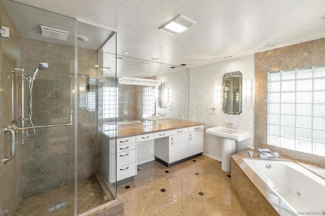 bathroom featuring vanity and shower with separate bathtub