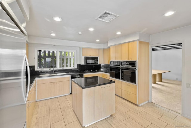 kitchen with a kitchen island, sink, light brown cabinets, and black appliances