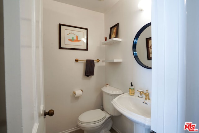 bathroom with toilet and sink