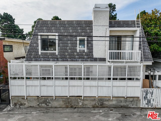 exterior space with a balcony