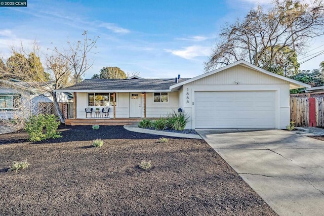 single story home featuring a garage and covered porch