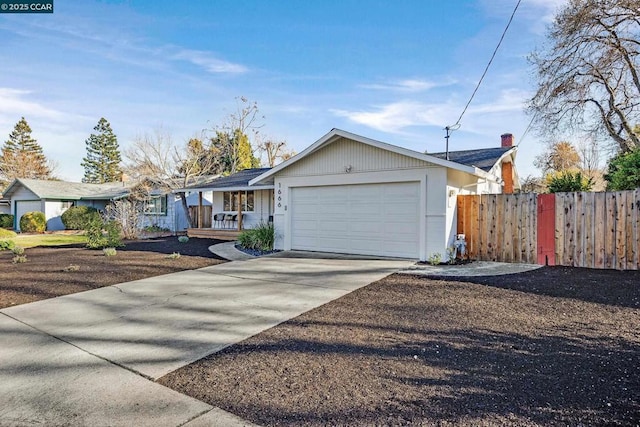 ranch-style house with a porch and a garage