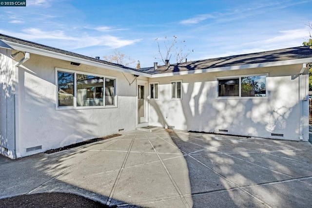 back of house featuring a patio area