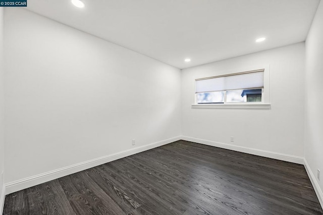 empty room featuring dark hardwood / wood-style flooring