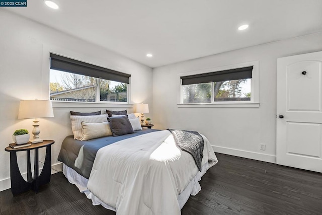 bedroom featuring dark hardwood / wood-style flooring