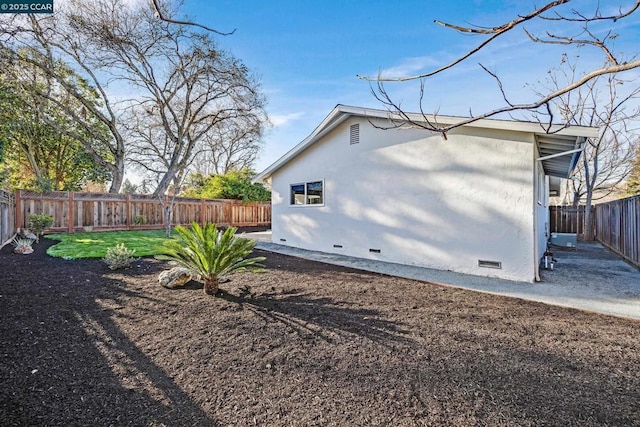 view of side of home featuring a lawn