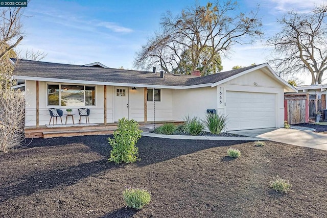 single story home featuring a garage and covered porch