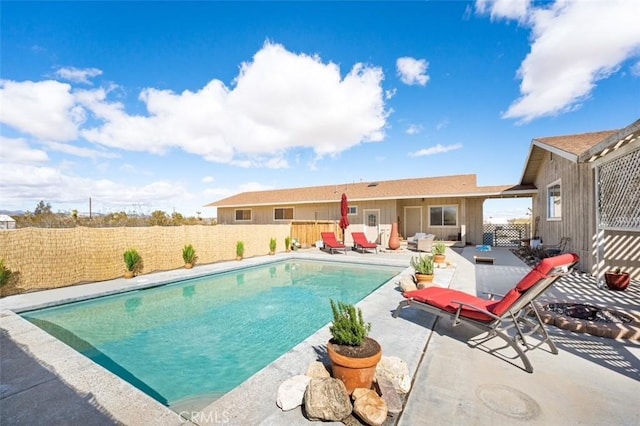 view of swimming pool with a fenced in pool, a fenced backyard, and a patio area