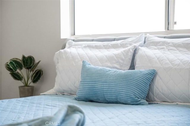 bedroom featuring multiple windows