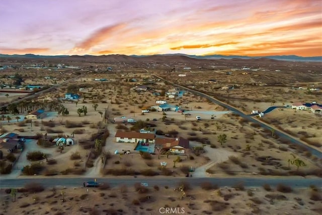 aerial view at dusk with a mountain view