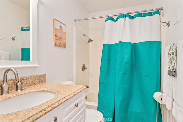 full bathroom with vanity, toilet, and shower / bathtub combination with curtain