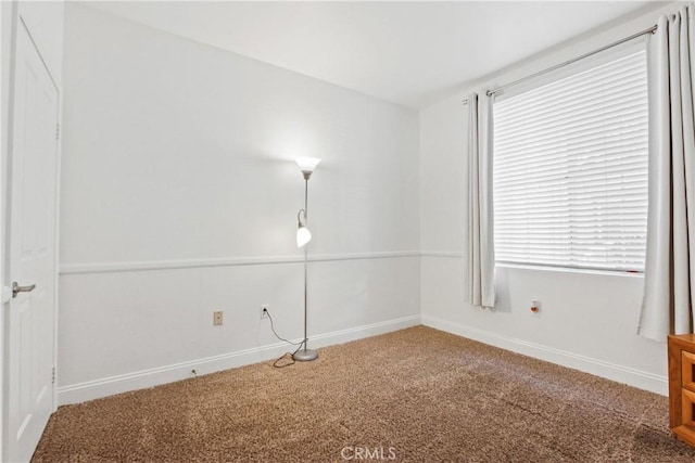 unfurnished room with carpet floors