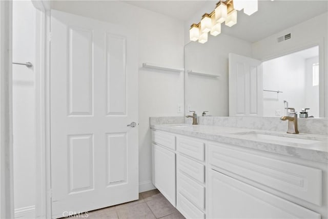 bathroom featuring vanity and tile patterned flooring