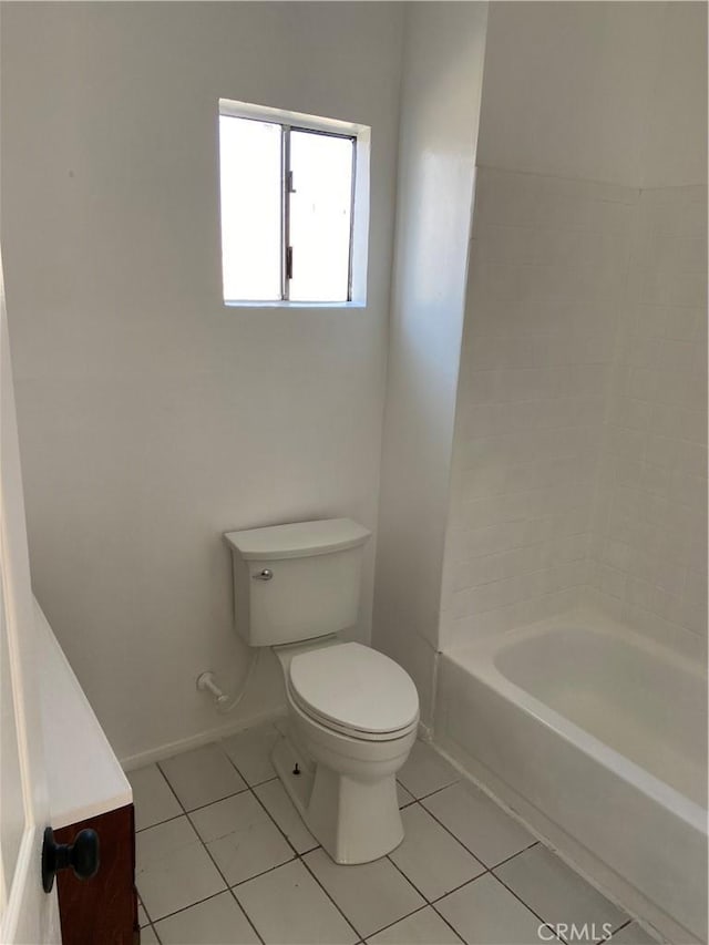 bathroom with tile patterned flooring and toilet