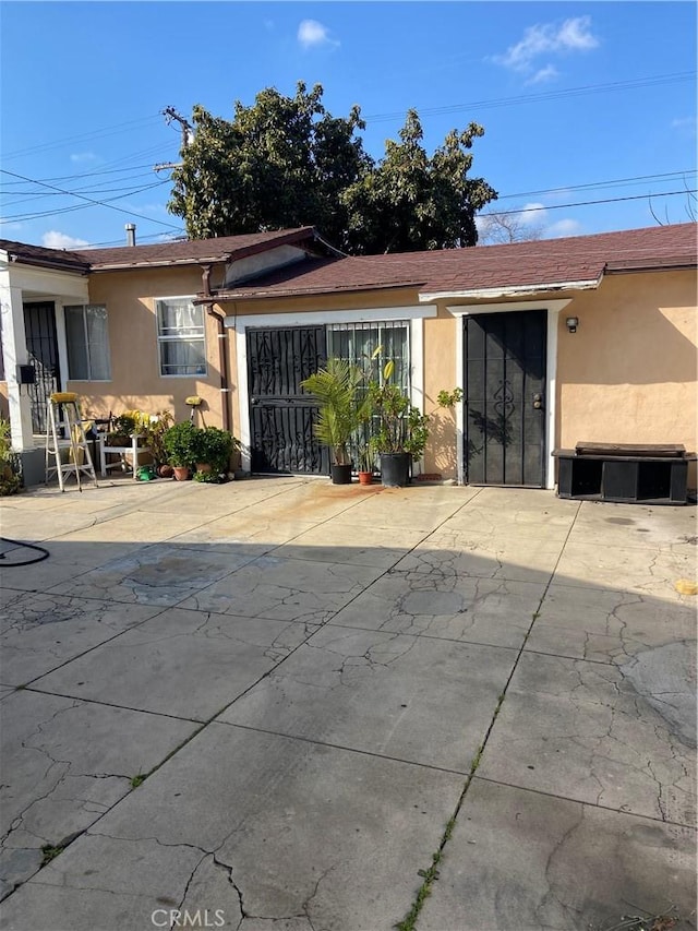 rear view of house featuring a garage