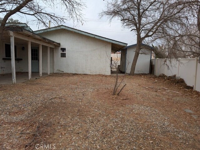 view of property exterior featuring a shed