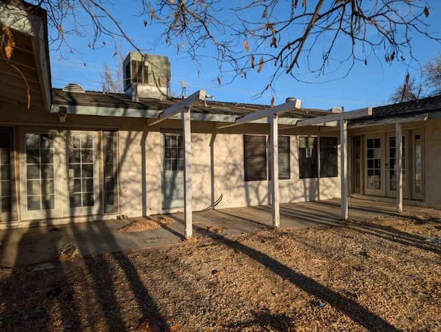 rear view of property with a patio area and french doors