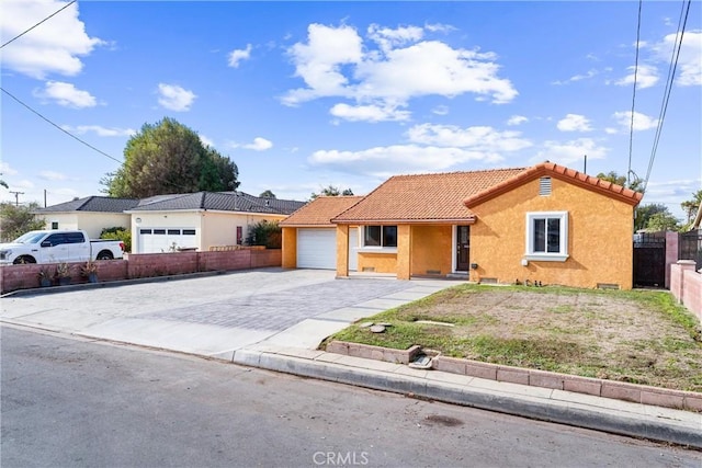 single story home featuring a garage