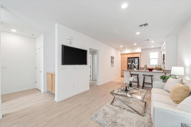 living room featuring light hardwood / wood-style flooring