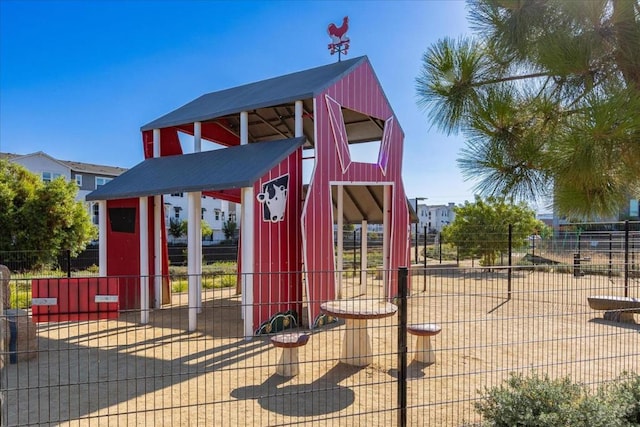 view of outdoor structure featuring a playground