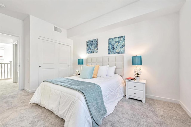 carpeted bedroom featuring a closet