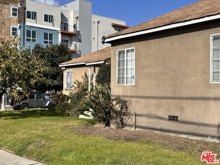 view of home's exterior with a yard