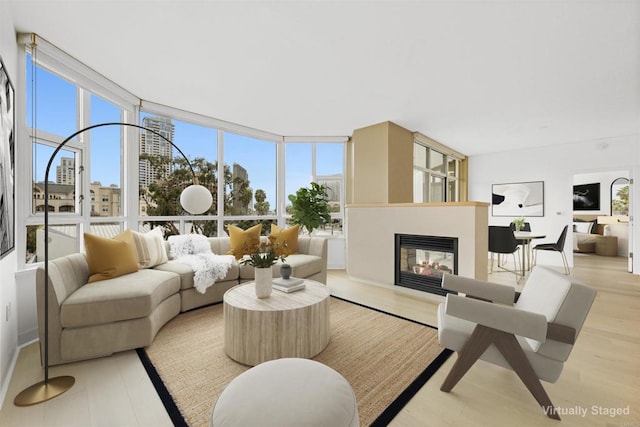 living room with floor to ceiling windows and a wealth of natural light