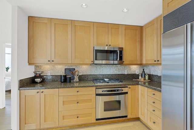 kitchen with stainless steel appliances and light brown cabinets