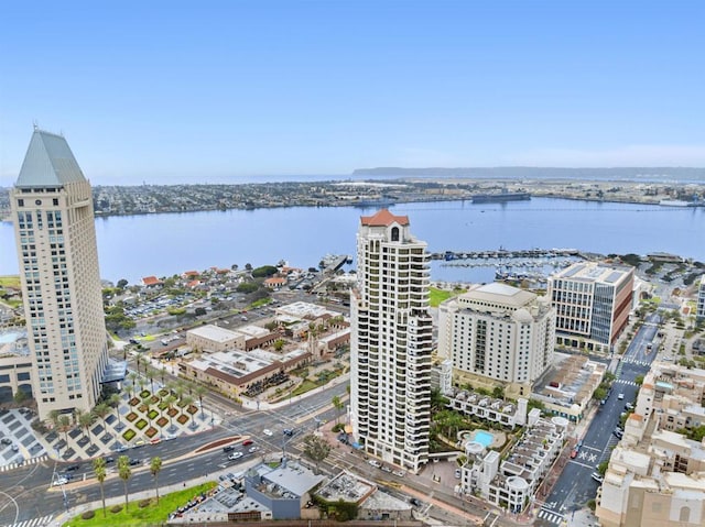 birds eye view of property featuring a view of city and a water view