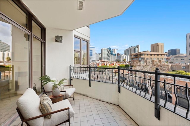 balcony featuring a view of city and visible vents