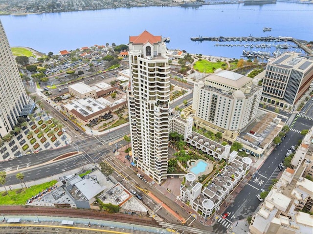 birds eye view of property with a view of city and a water view