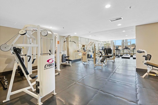 workout area with recessed lighting, visible vents, and baseboards