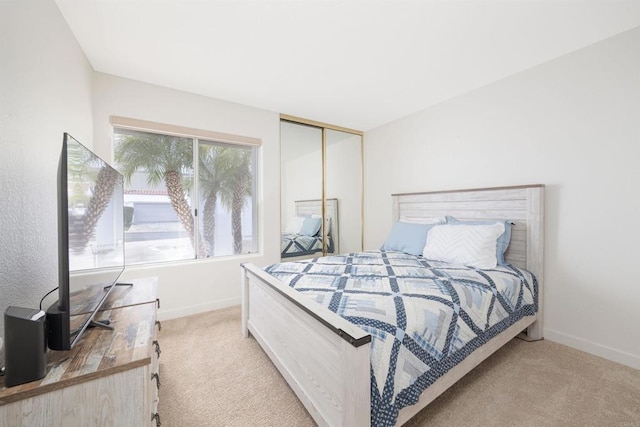 carpeted bedroom featuring a closet