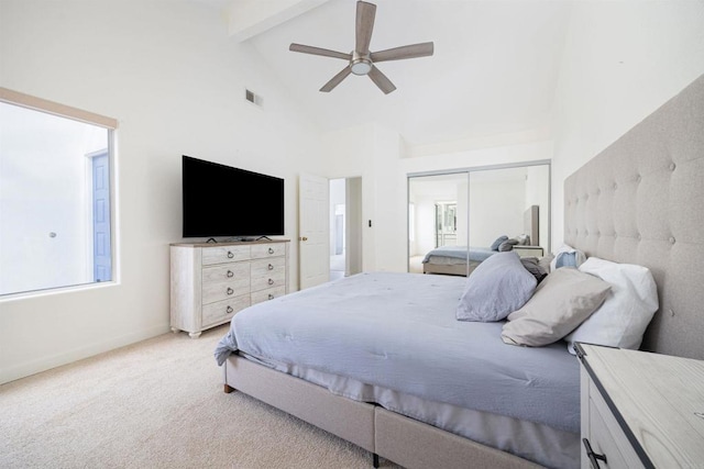 carpeted bedroom featuring beamed ceiling, high vaulted ceiling, ceiling fan, and a closet