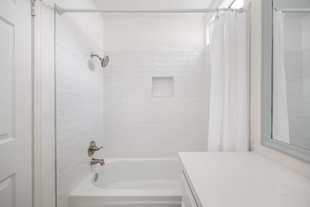 bathroom featuring shower / tub combo with curtain and vanity