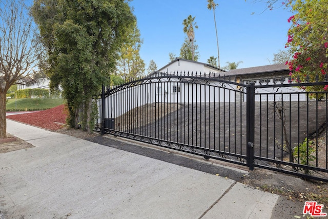 view of gate featuring a garage