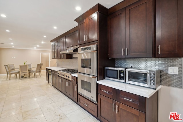 kitchen featuring tasteful backsplash, appliances with stainless steel finishes, crown molding, and dark brown cabinets