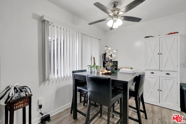 dining room with light hardwood / wood-style flooring and ceiling fan