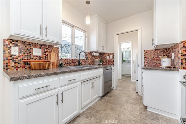 kitchen with sink, tasteful backsplash, decorative light fixtures, dishwasher, and white cabinets