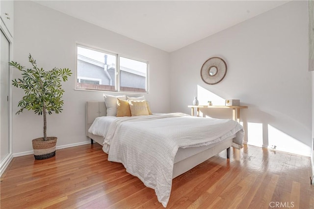 bedroom with light wood-type flooring