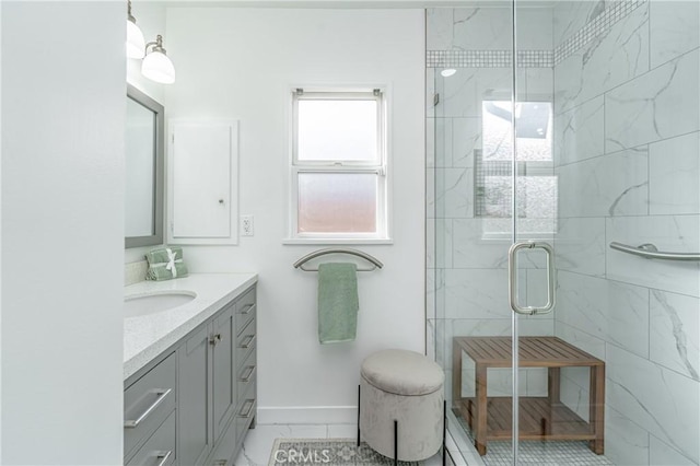 bathroom with vanity and a shower with shower door