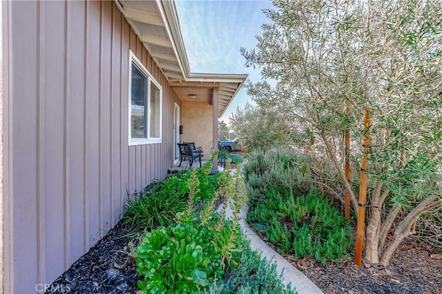 view of side of property with board and batten siding