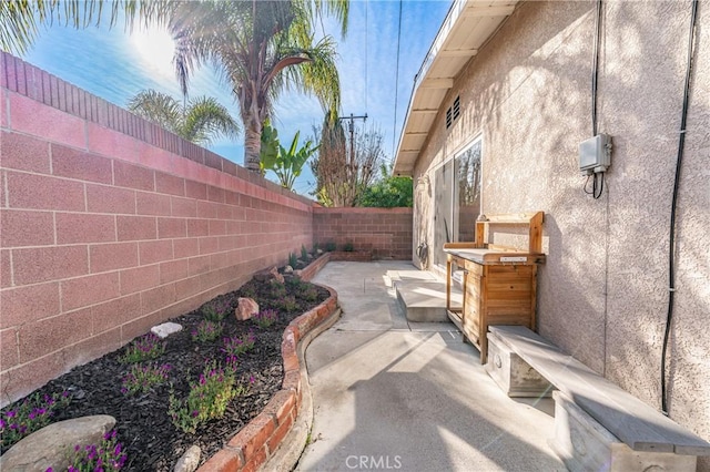 view of patio with a fenced backyard