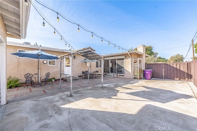 back of property featuring a patio