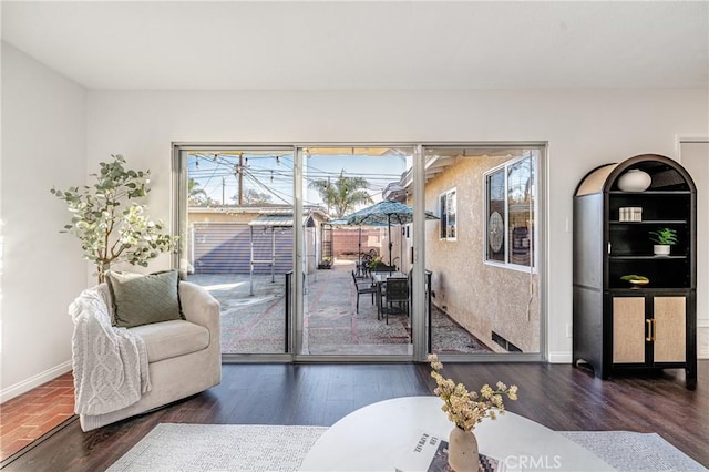 living room with dark hardwood / wood-style floors