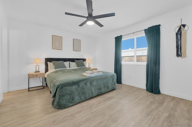 bedroom featuring ceiling fan and light hardwood / wood-style floors