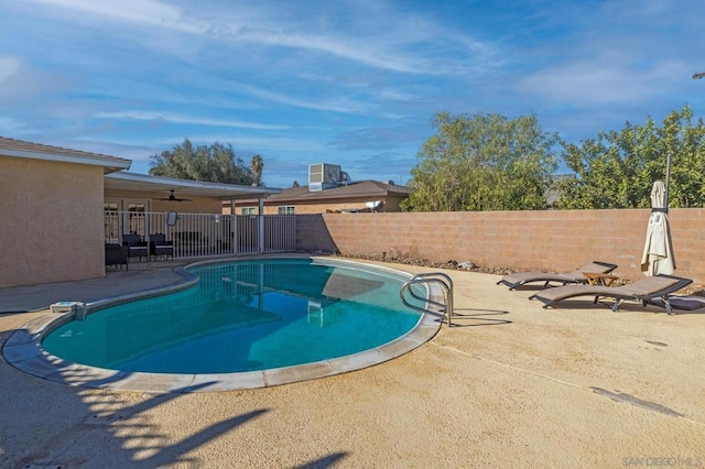 view of pool with ceiling fan and a patio area