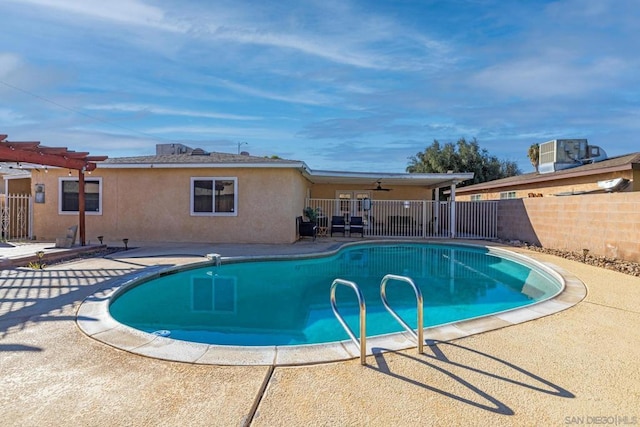 view of pool featuring central AC unit, a pergola, a patio, and ceiling fan