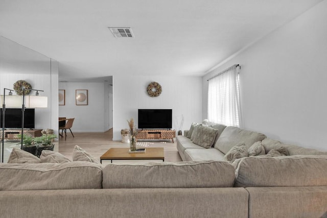 living room with light hardwood / wood-style floors