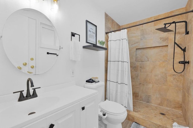 bathroom featuring walk in shower, vanity, and toilet